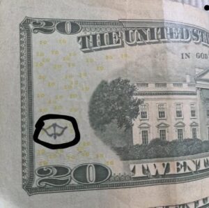 Why a Bow and Arrow Symbol Appears in Certain U.S. Currency Designs